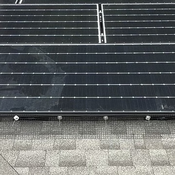 Person working on solar panel installation